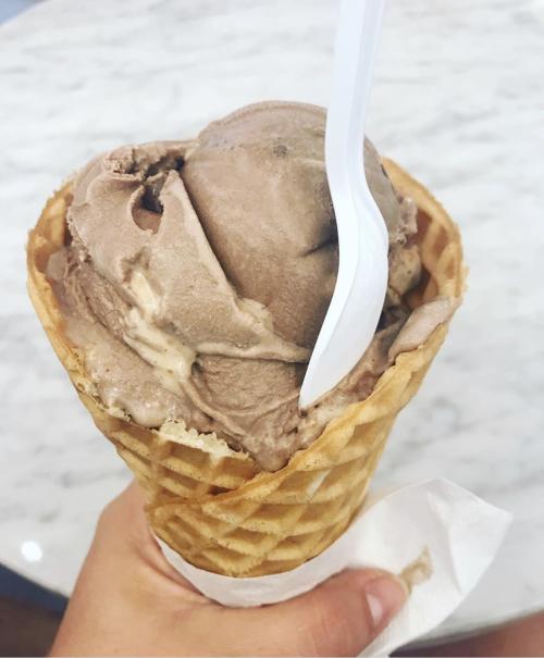 Ice cream scoops sit nestled in a waffle cone from Gelati Celesti Ice Cream.