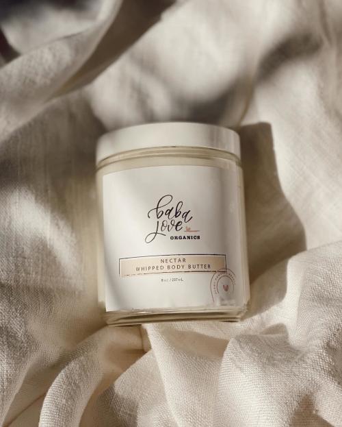 A tub up Baba Love Organics whipped body butter.