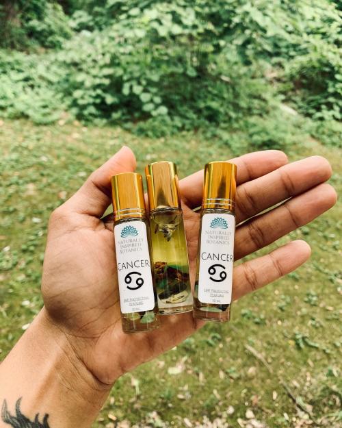 Three samples of Naturally Inspired Botanicals crystal-infused perfumes.