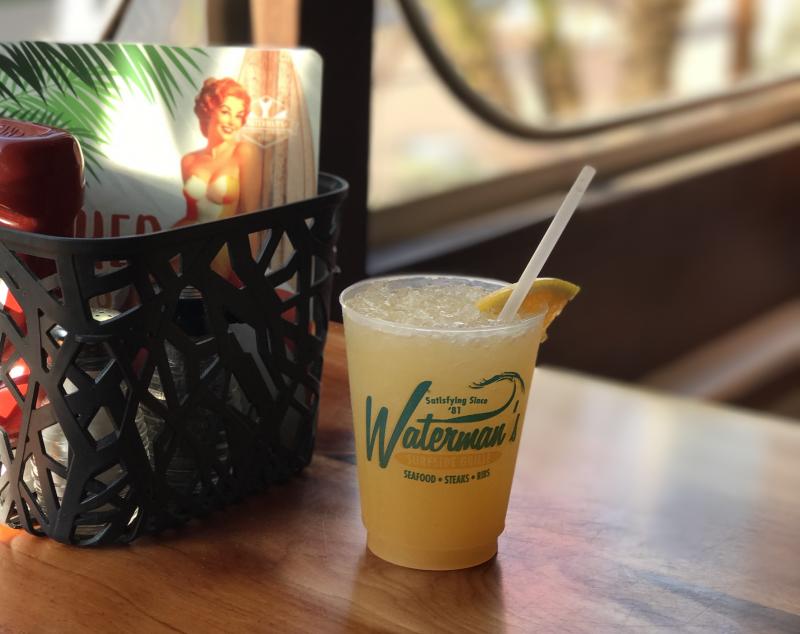 Waterman's Orange Crush on a table next to a condiment basket