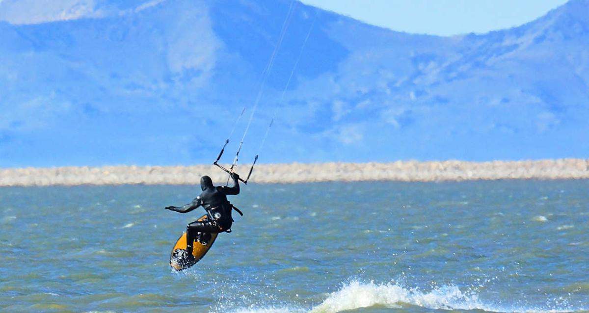 Kite surfer in a wetsuit at Willard Bay State Park