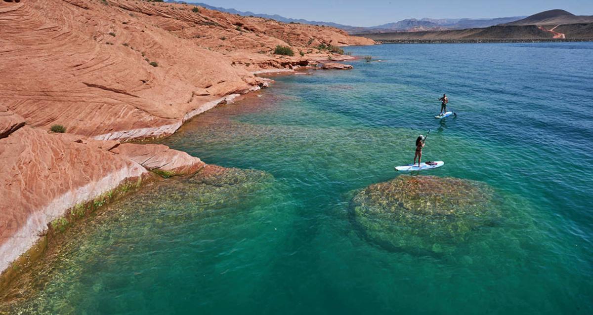 Two people paddle boarding at Sand Hollow Reservoir