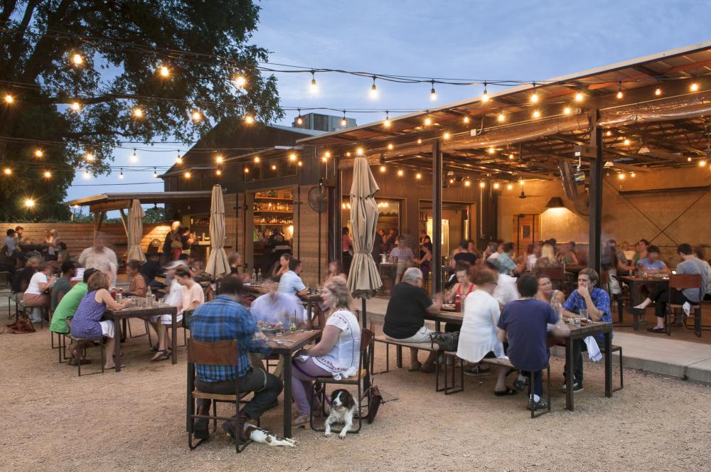 Contigo Beer Garden at twilight with twinkle lights