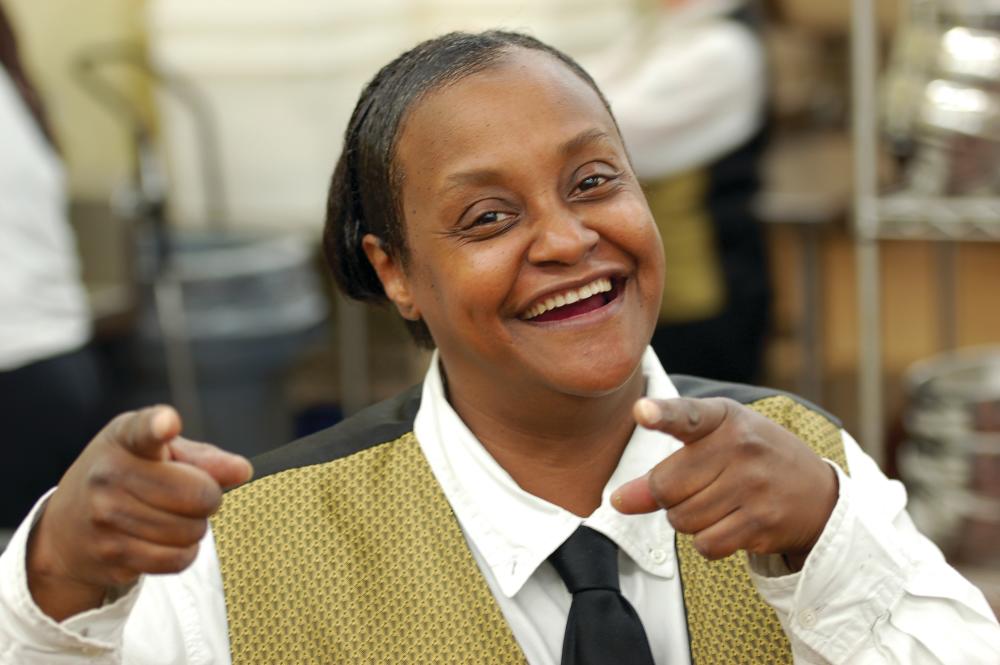 A Grand Wayne Convention Center employee cheerfully acknowledges the camera