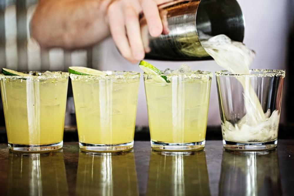 Bar tender pouring margaritas at La Condesa