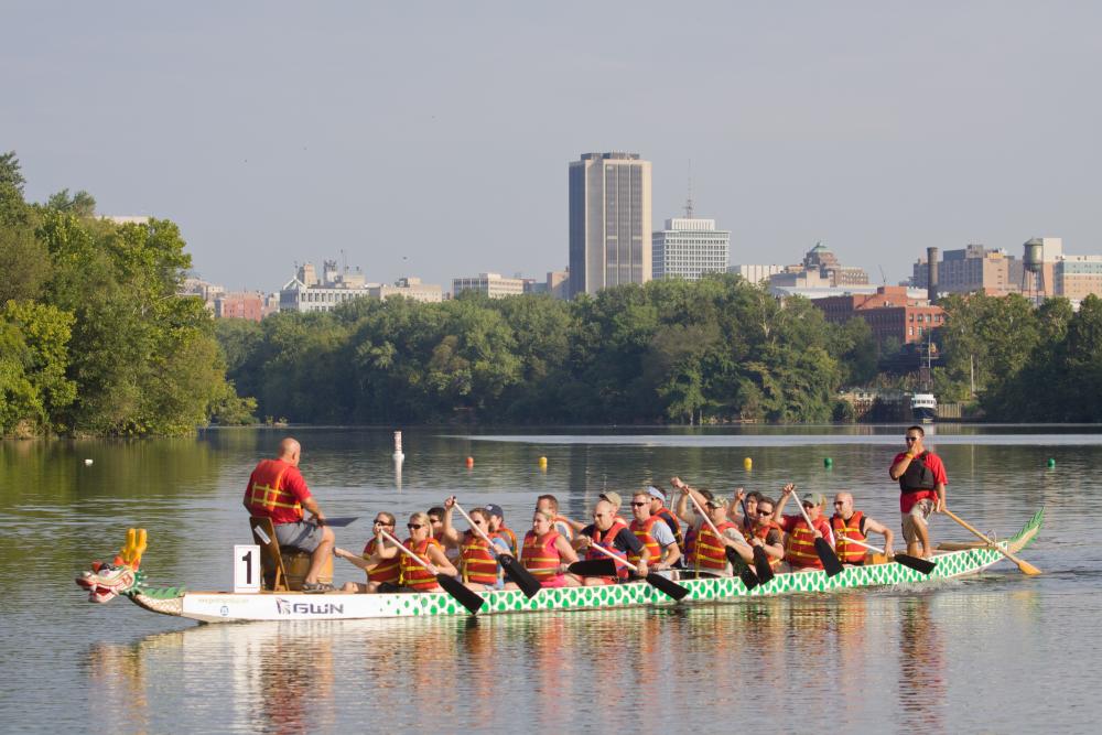 People Rowing A Boat At The Dragon Boat Festival In Richmond, VA