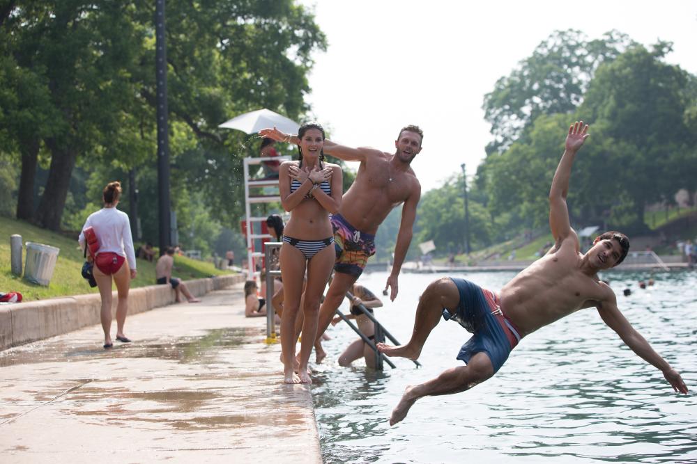 Jumping in to Barton Springs Pool.
