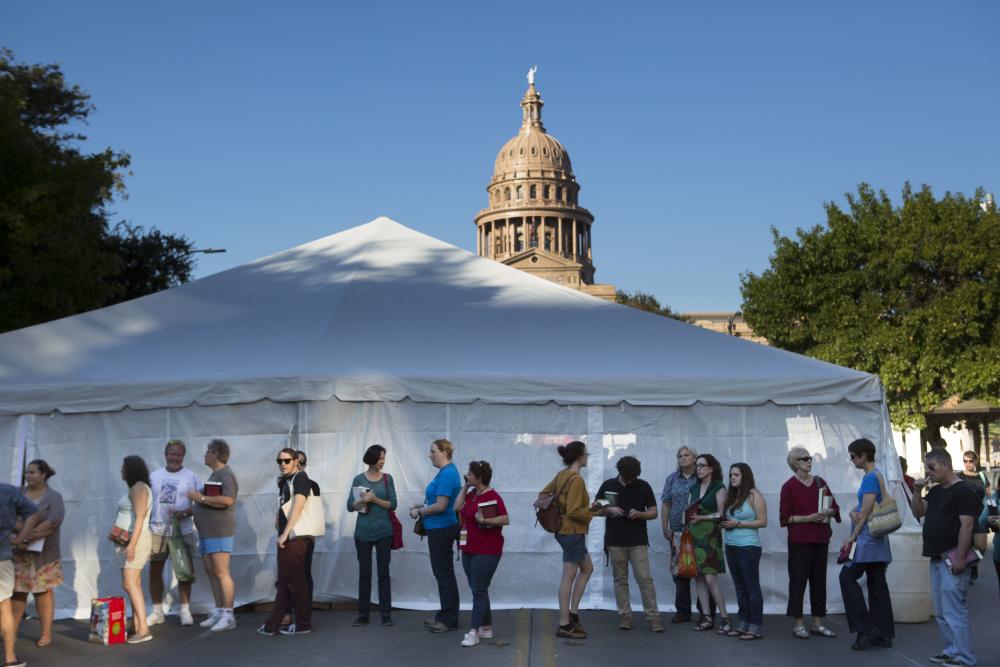 People wait in line at the Texas Book Festival in front of the capitol building