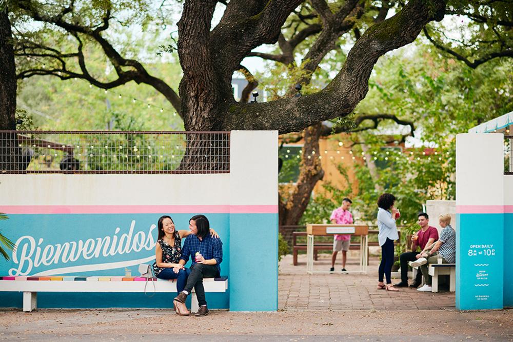 Couple sitting outside of the Fresas patio in Austin Texas