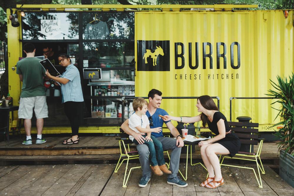 Couple with child outside of Burro Food Truck in Austin Texas