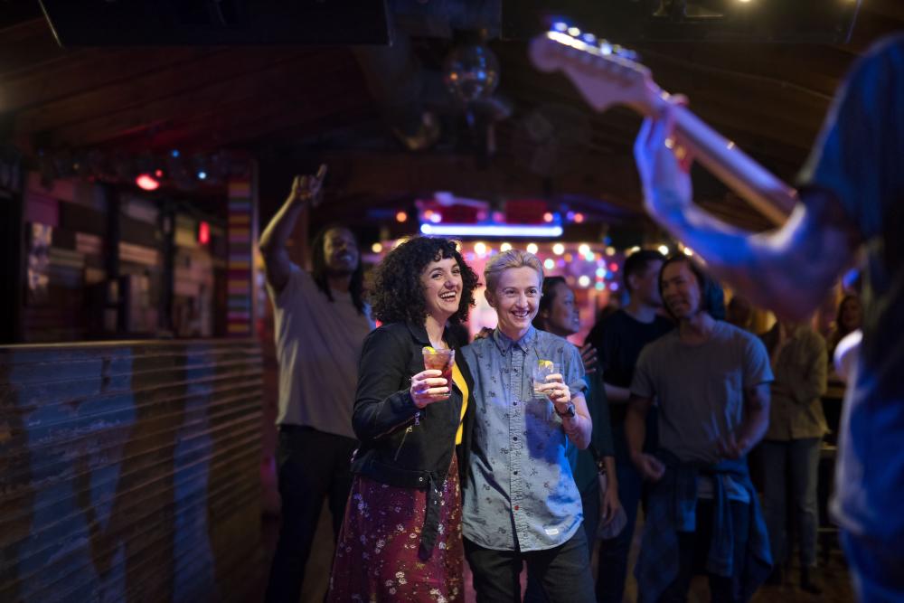 Couple watching live music show at Cheer Up Charlies in Austin Texas