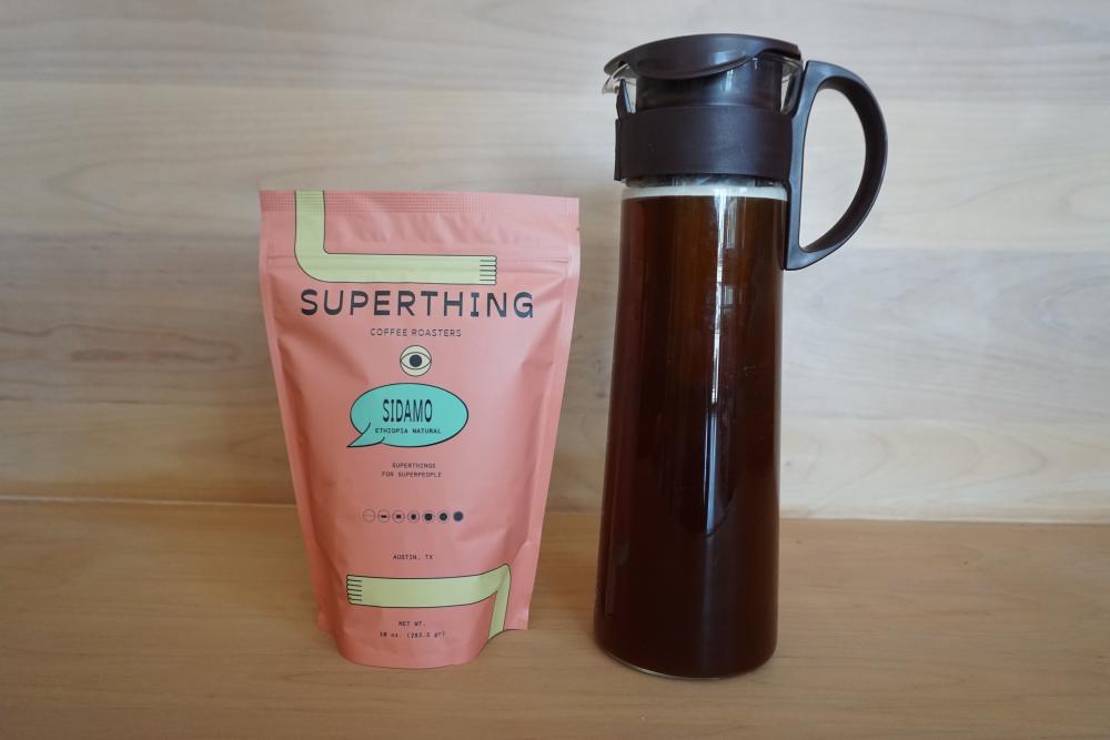 Bag of Superthing Coffee next to cold brew coffee from Patika in Austin Texas