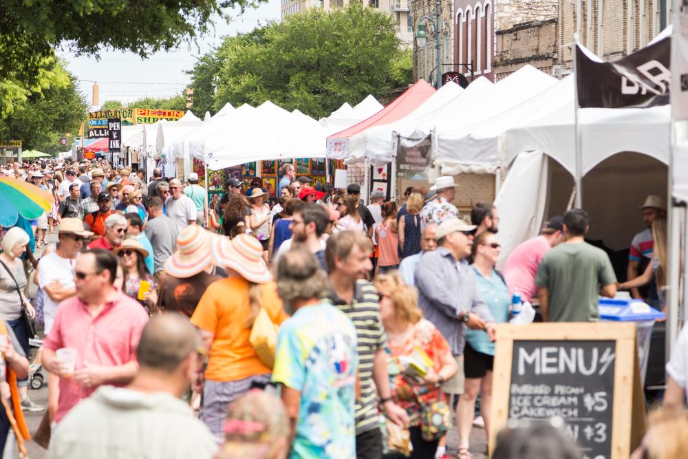 Crowd on the street at the Spring Pecan Street Festival