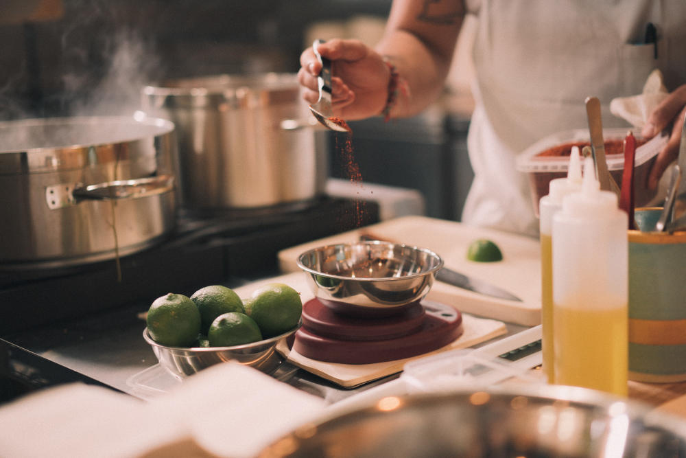 Chef Fermin Nunez prepares a dish in the kitchen of Suerte in Austin Texas