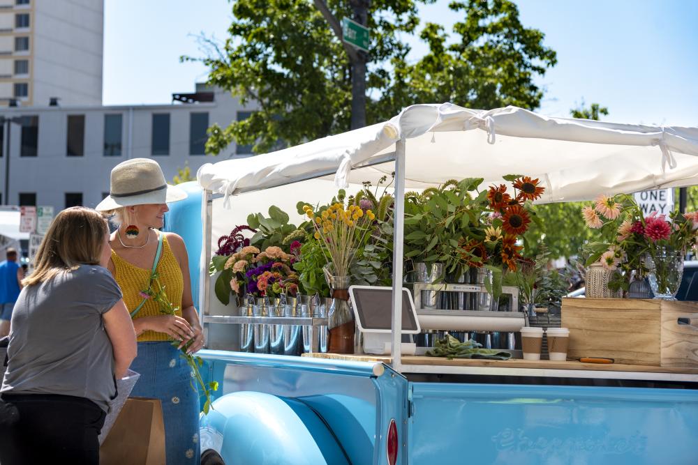 Shopping at the flower truck at the downtown Fort Wayne farmers market