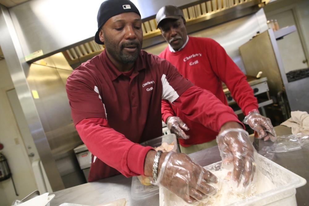 Charles Washington prepares an order in the kitchen of Charlow's Grill