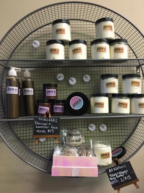 A selection of BOSH Co bath & body care products sit on a display shelf.