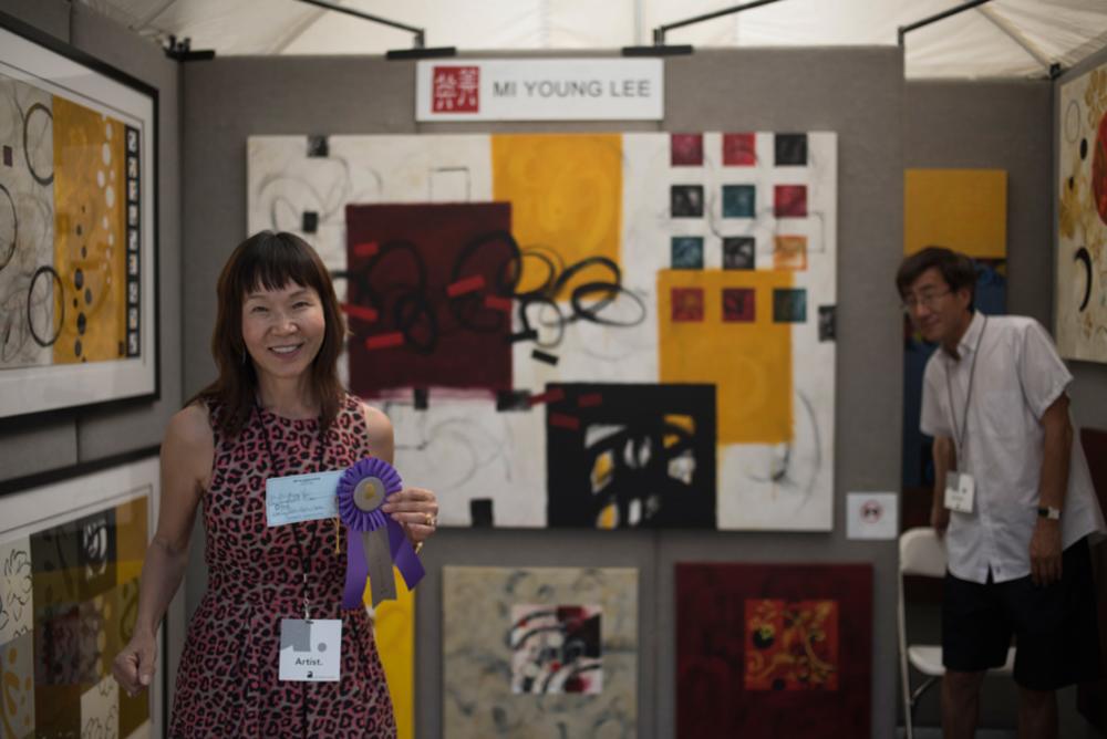 Artist MiYoung Lee and her booth from Art City Austin 2015