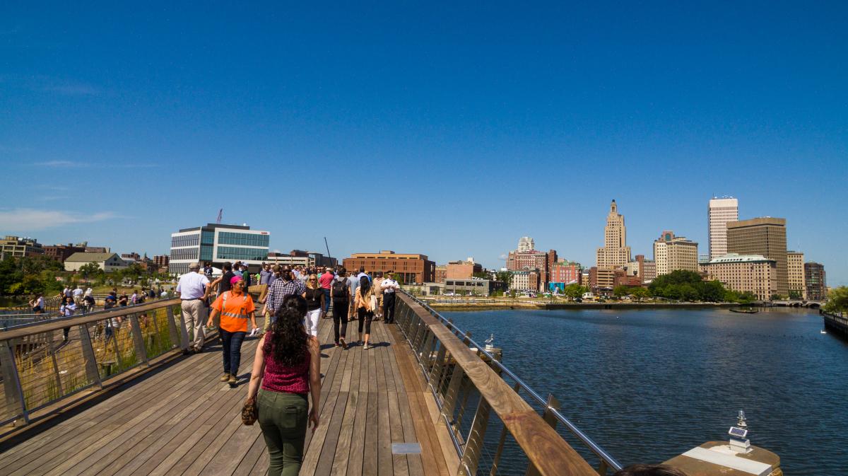 Visitors walk along the Pedestrian Bridge in Providence, RI