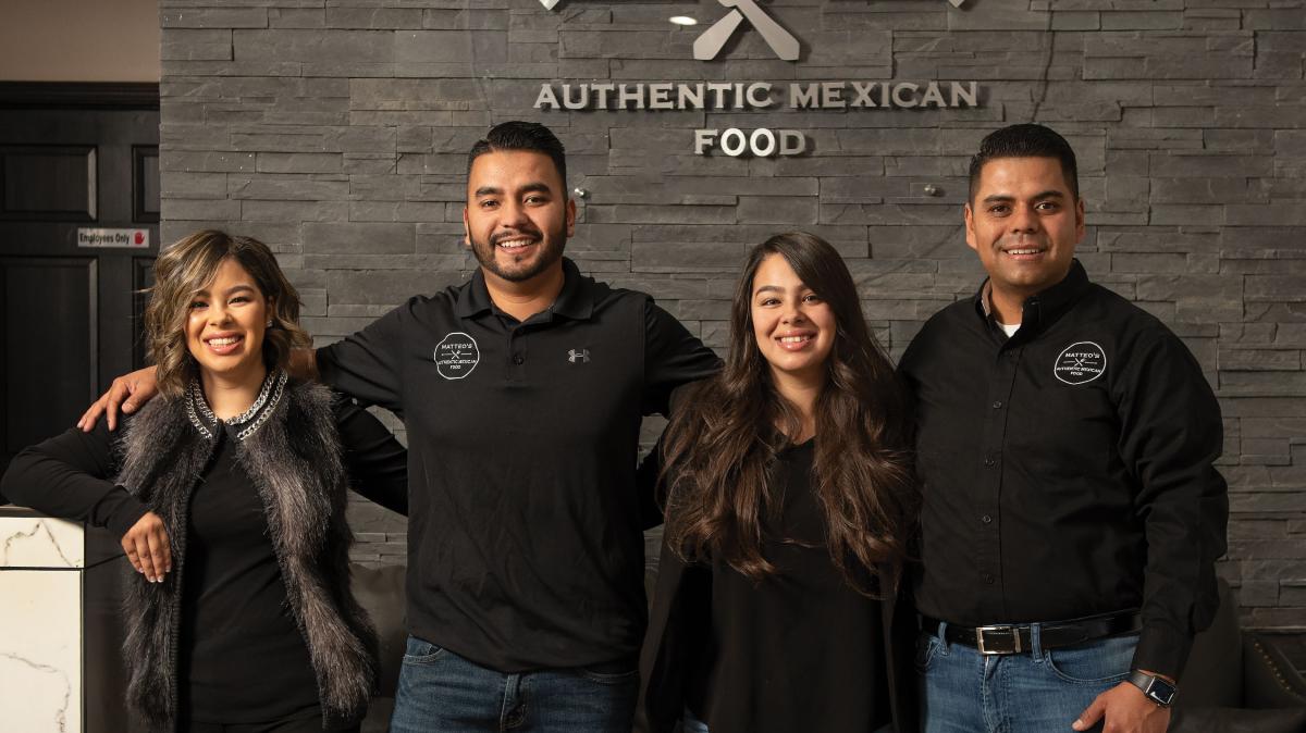 Melody, Hugo, Michelle, and Sergio Rios serve authentic aguas frescas.