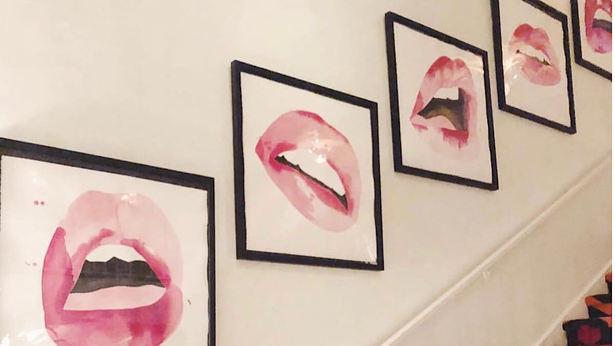 Photo of pink lips on white mating with black frames