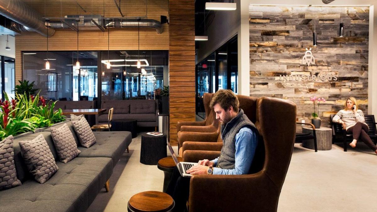 People utilize the open spaces at one of two Industrious locations in Columbus, OH. 