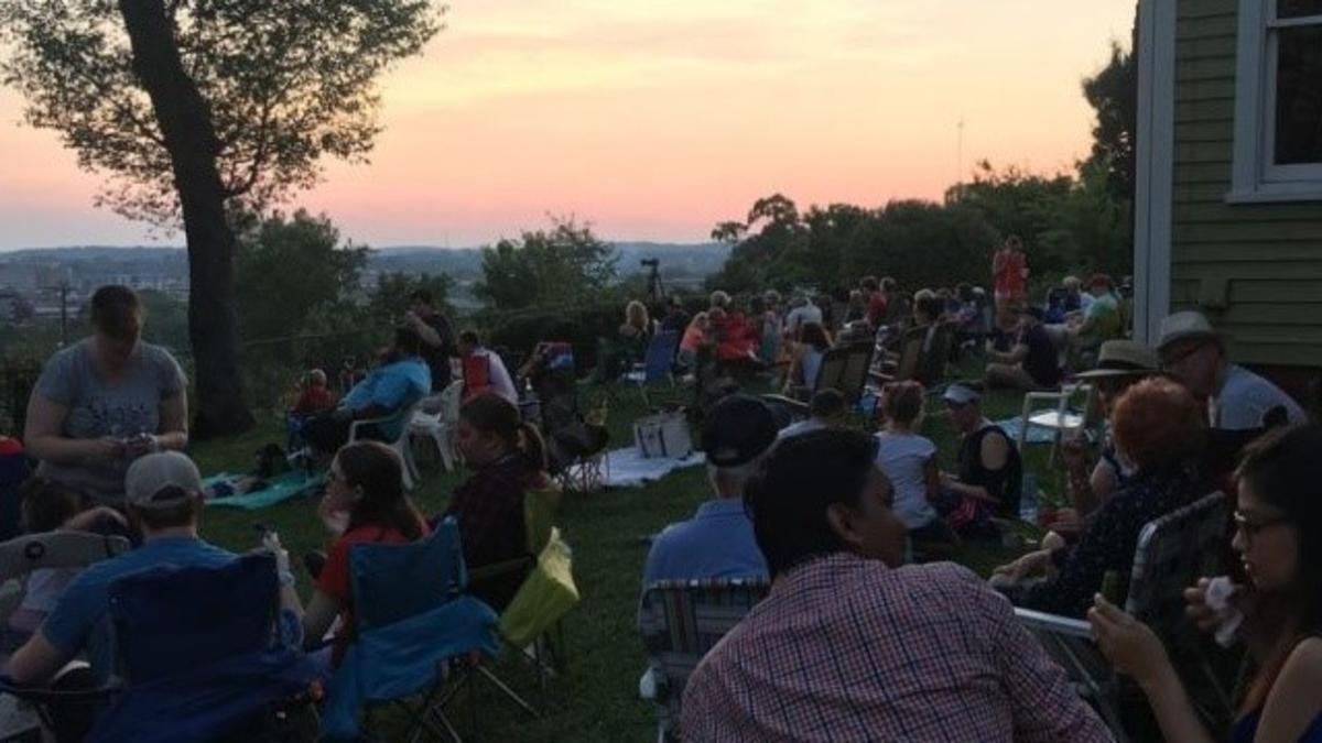 People Sitting on Chairs and Blankets at dusk on Mabrys Hill