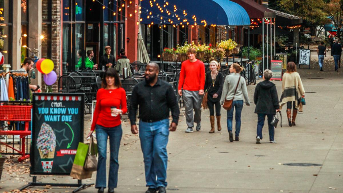 People Walking Along Patios At Market Square In Knoxville, TN