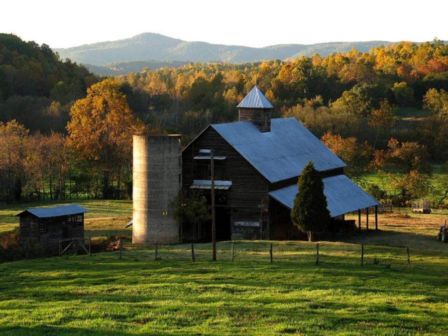 Old fashioned barn surrounded by fall color
