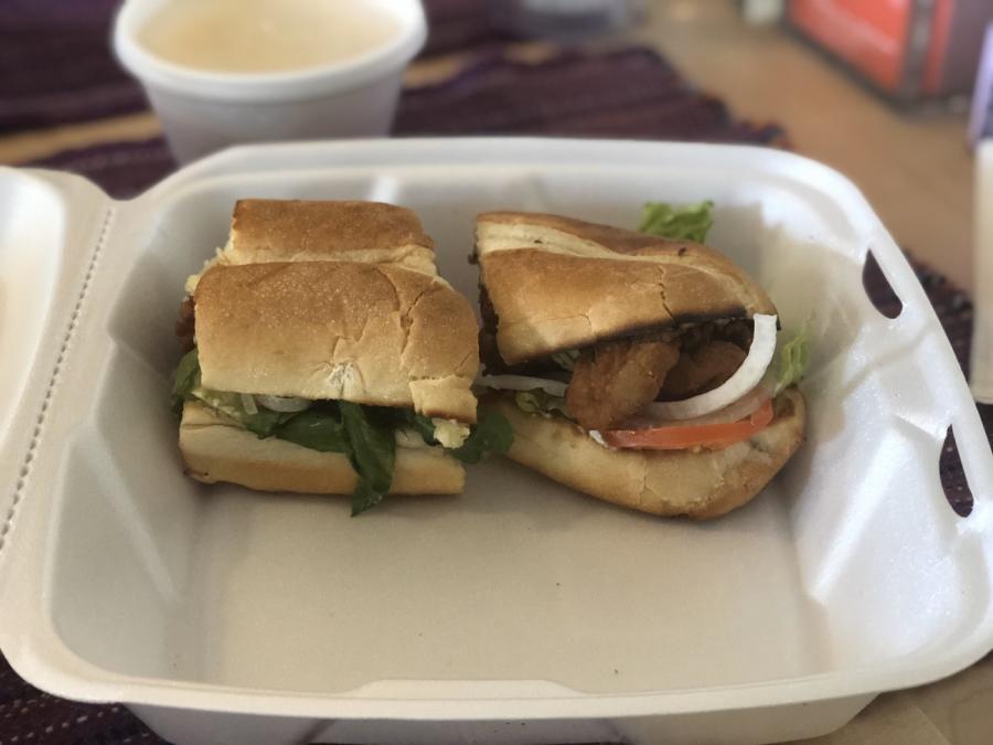 A fried oyster po'boy in a to-go container from a Huntsville, AL restaurant