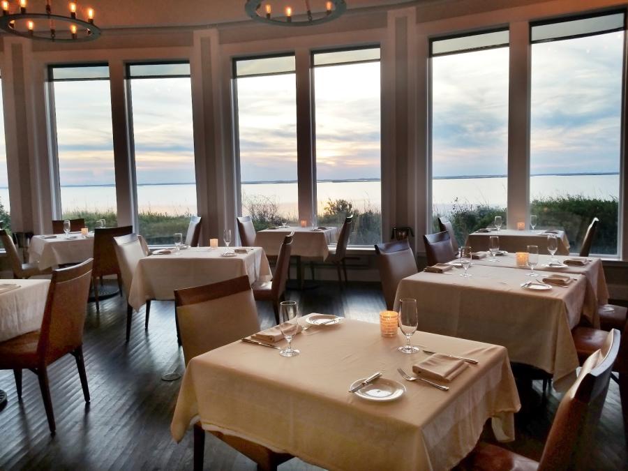 Tables overlooking the sunset on the water at Kimball's Kitchen in Duck, NC