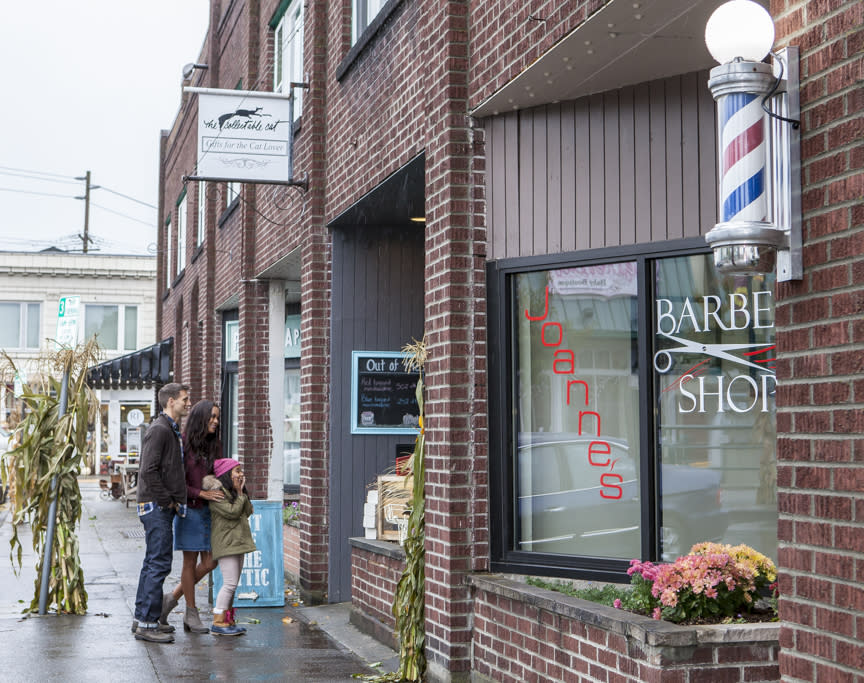 Mother, Father and Daughter Windows shopping in Sumner, Washington