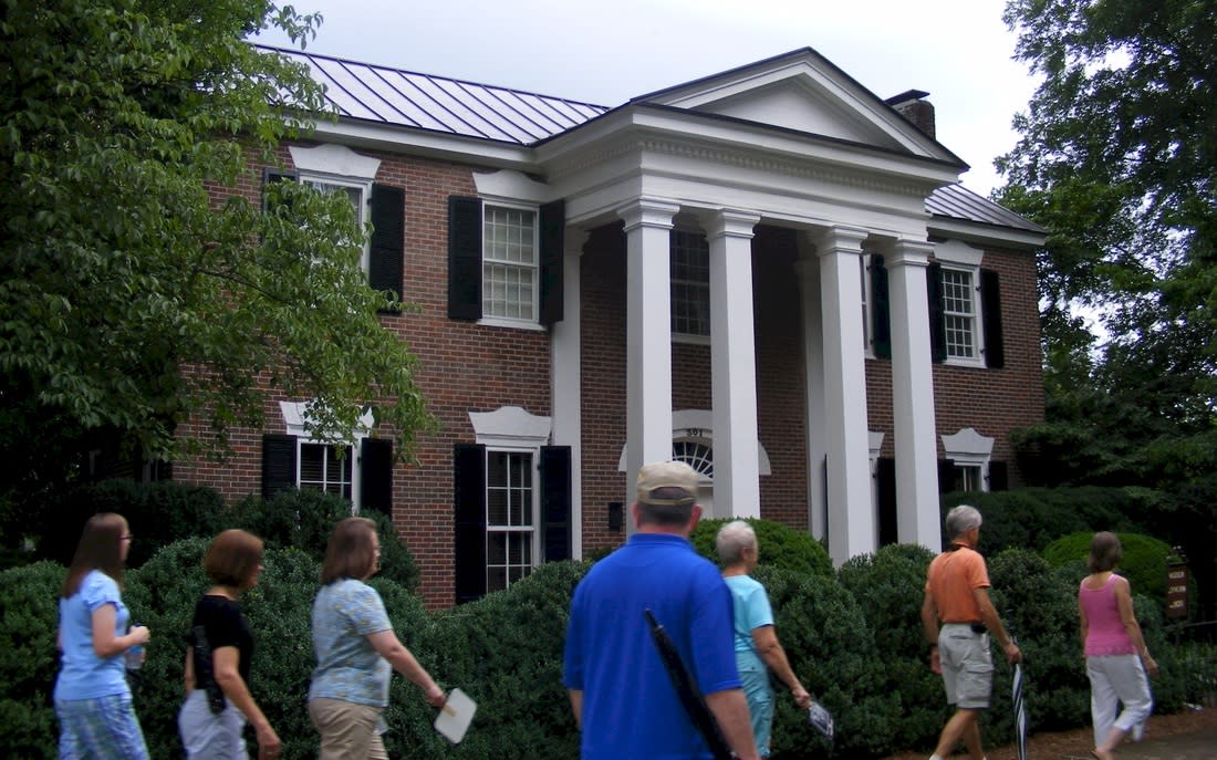 Exterior view of historic building in Athens, AL with walking tour in foreground