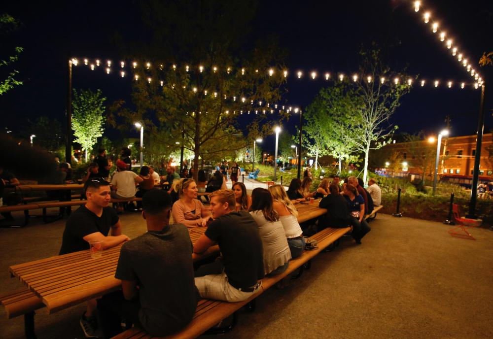 Promenade Park visitors enjoy the Journal Gazette Dining Gardens at Night