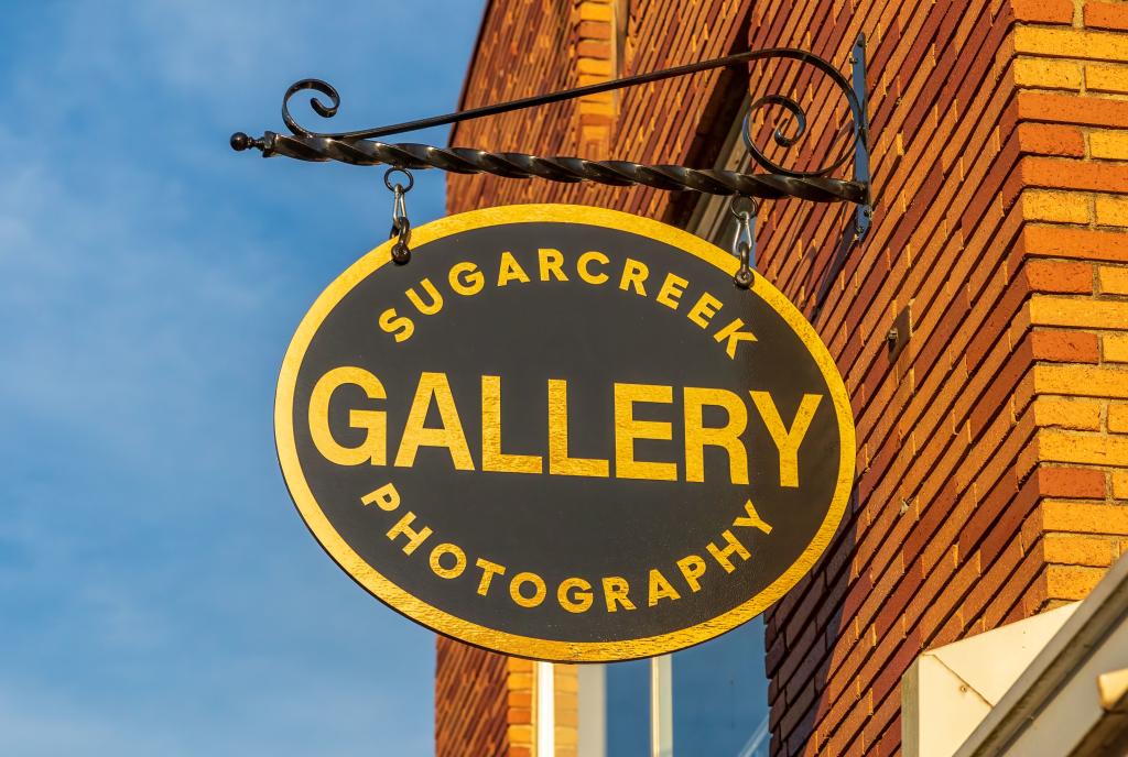 Sugarcreek Photography Gallery Sign in Warm Light