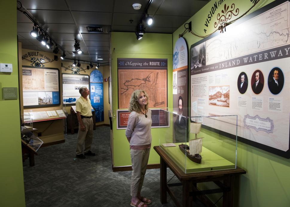 Visitors looking at interior exhibit at Erie Canal Museum
