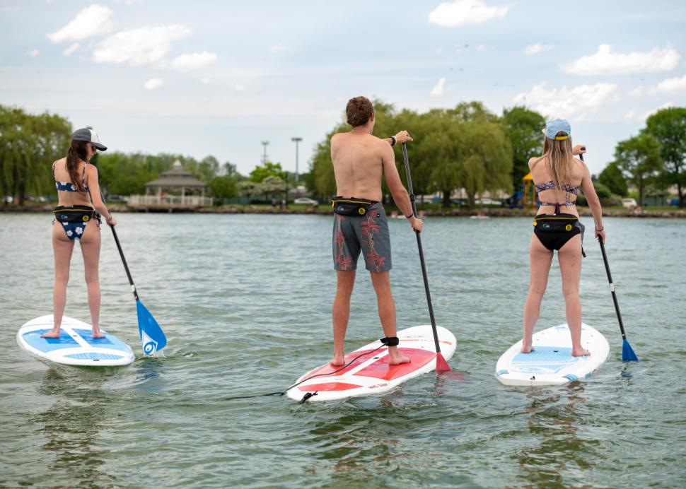 People stand up paddleboarding