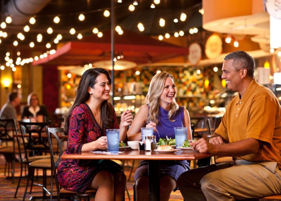 Photo of a Family smiling while dining in the Finger Lakes Gaming and Racetrack