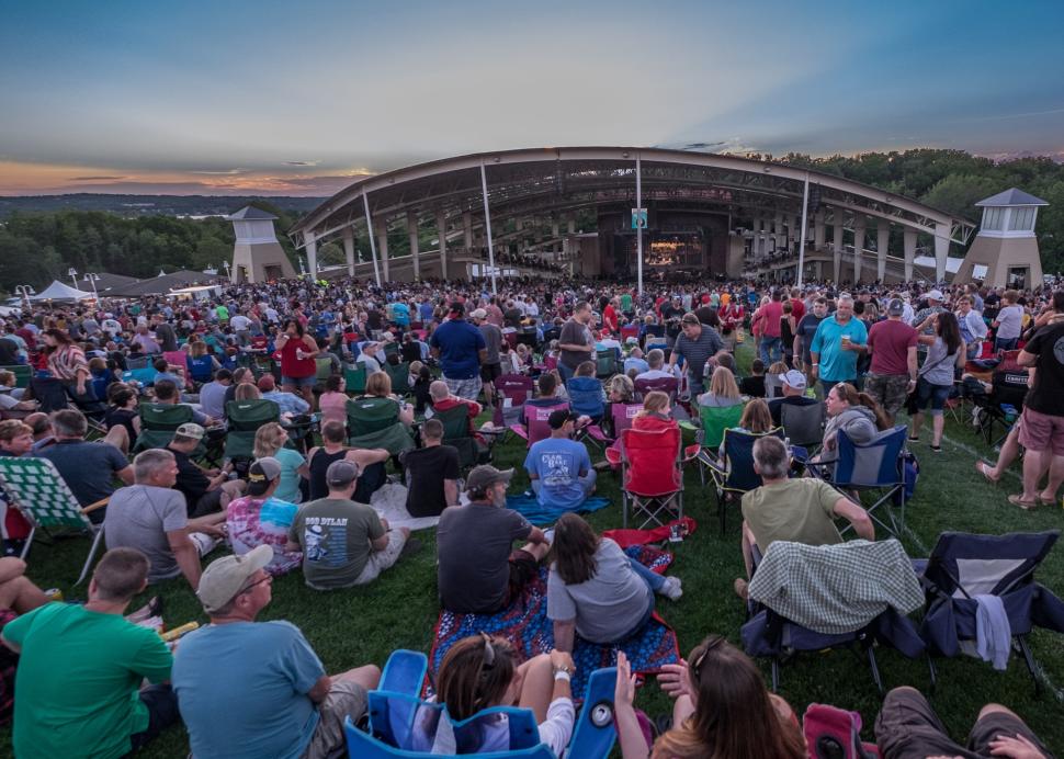 Photo of viewers sitting on the lawn at the CMAC Center in Canandaigua