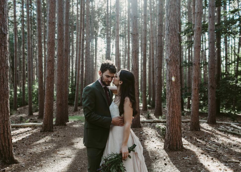 Bride and Groom embrace in the woods at the Cummings Nature Center