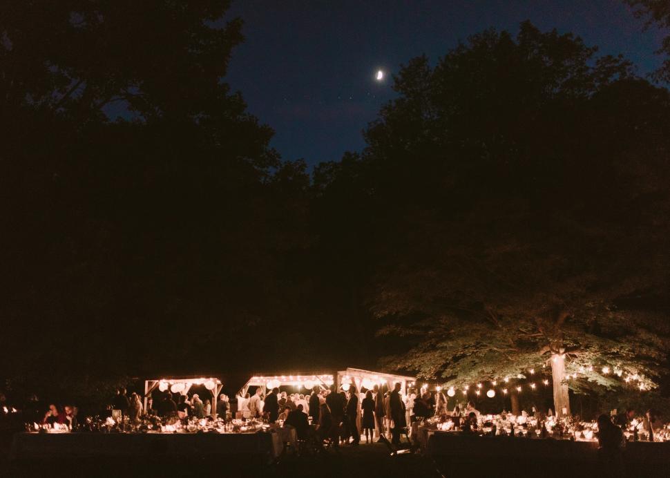 Photo of the Cummings Nature Center lit up at nighttime for a wedding