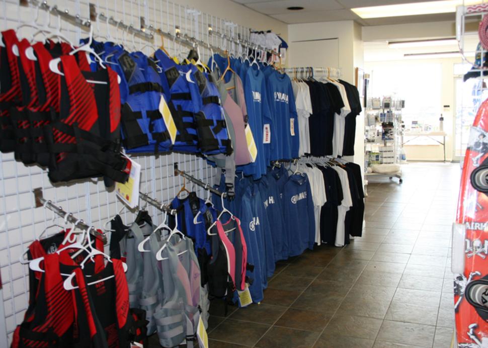Water clothing hangs from racks inside of Sutters Marina in Canandaigua