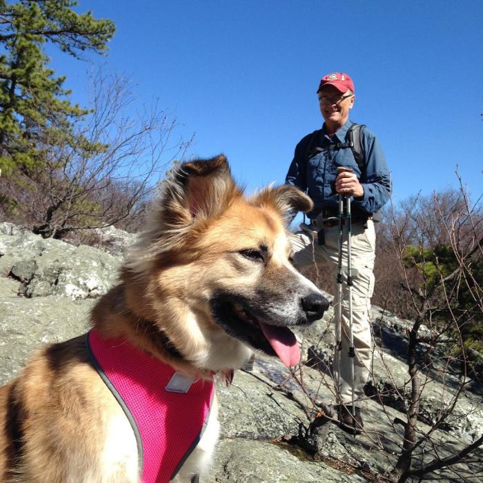 Hiker with his dog on a Frederick hiking trail