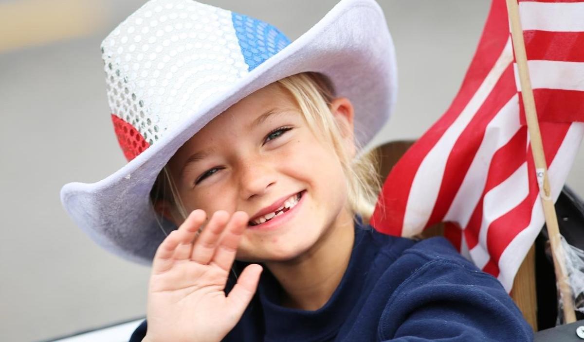 Blonde Girl with a Red, White & Blue Cowboy Hat on at the Town of Farragut parade