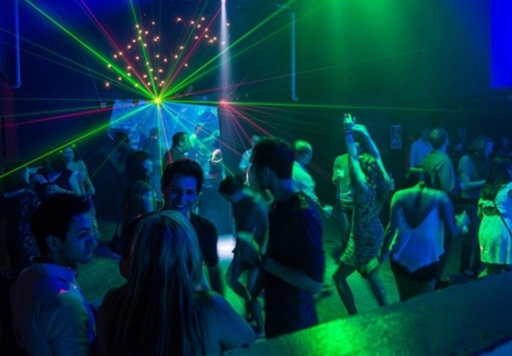 photo of a people dancing at a club