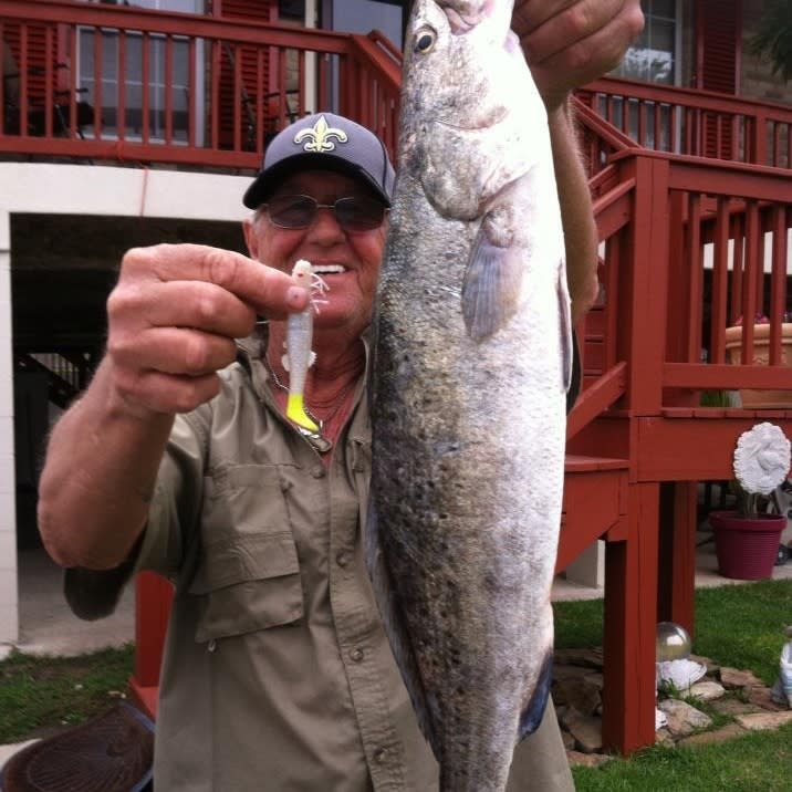Captain Kenny of Category 5 Lures Holding His Catch