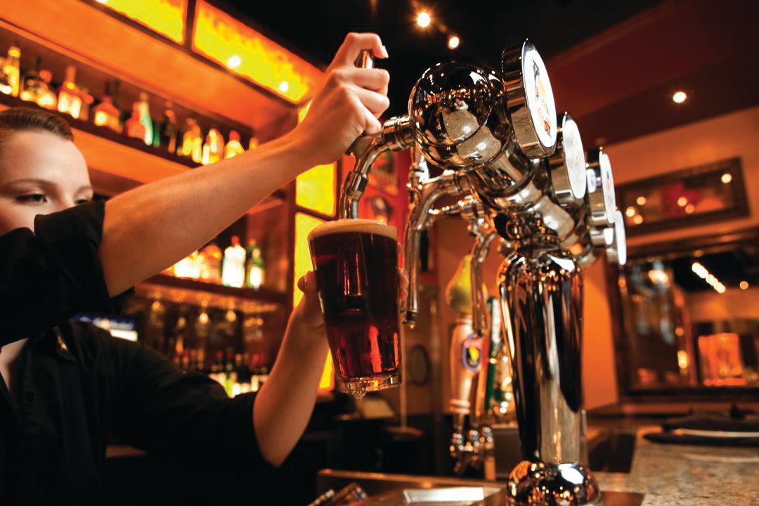 Man Pouring Beer At BJ's Restaurant & Brewhouse