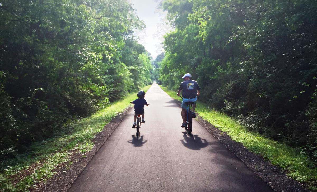 Father and Son Cycling the Tammany Trace in Louisiana Northshore