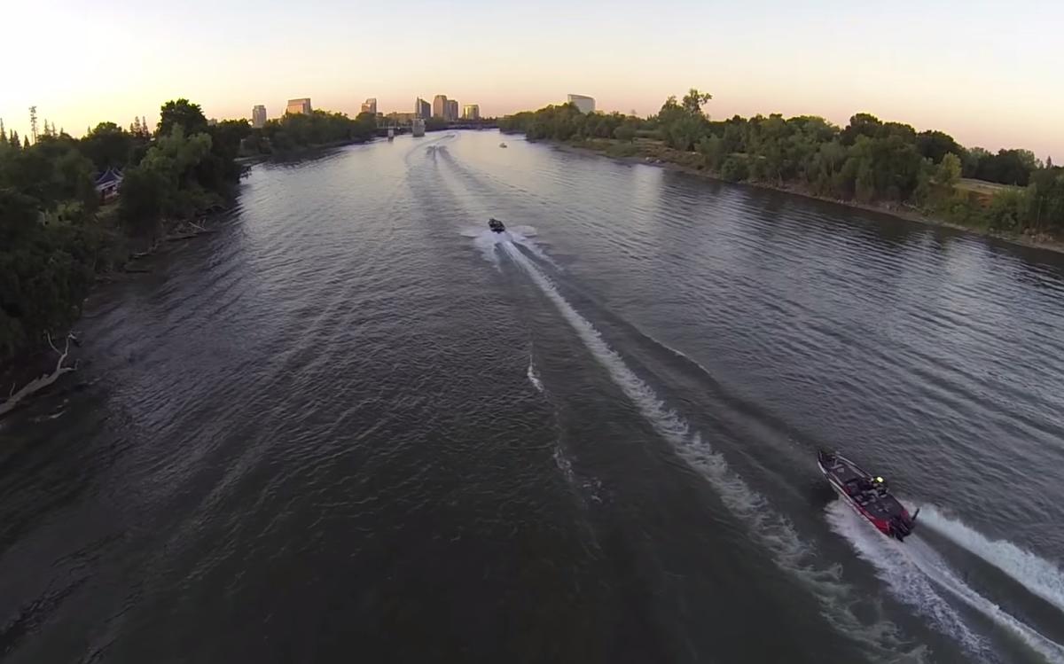 Bass Boats on River with Skyline