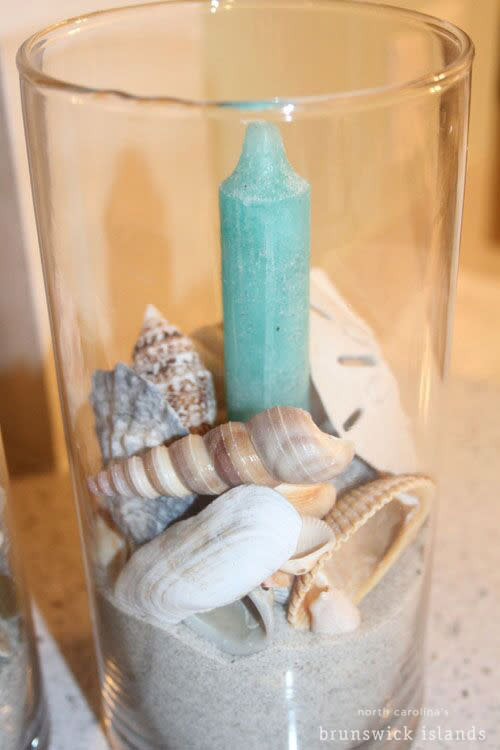 A candle crafted with seashells from NC's Brunswick Islands